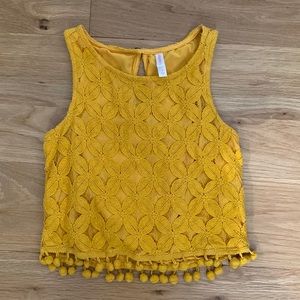 Boho crop top with embroidered design and tassel